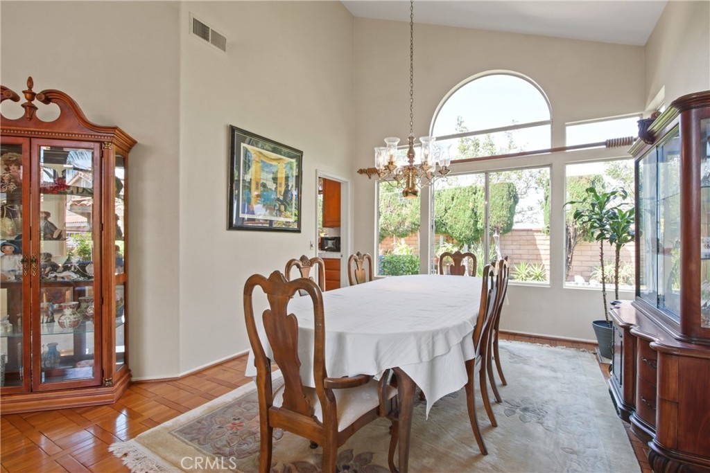 9221 Belcaro Drive Huntington Beach, CA 92646 - Photo 4 of 22 a view of a dining room with furniture window and outside view