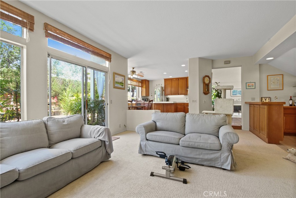9221 Belcaro Drive Huntington Beach, CA 92646 - Photo 5 of 22 a living room with furniture and a large window