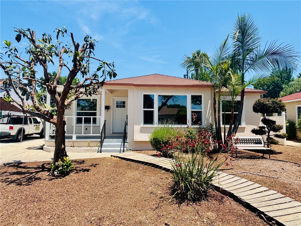 a front view of a house with sitting area