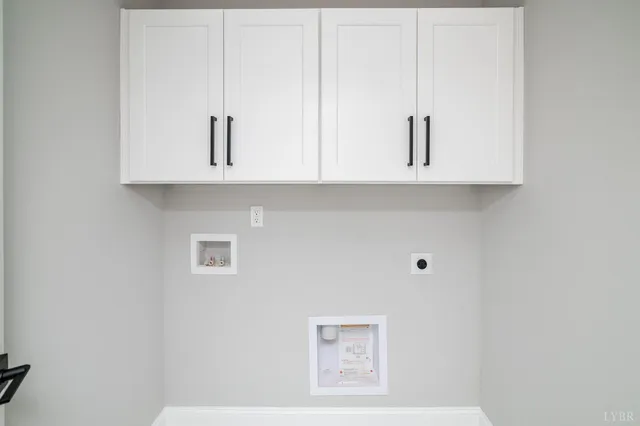 an empty room with ceiling fan and windows