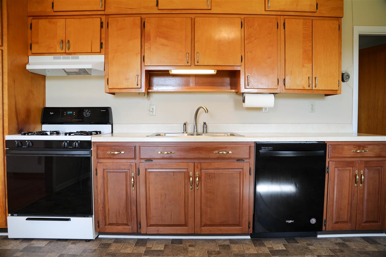 5163 East Timber Ridge Road Mount Crawford, VA 22841 - Photo 28 of 48 a kitchen with stainless steel appliances granite countertop a stove a sink and a microwave