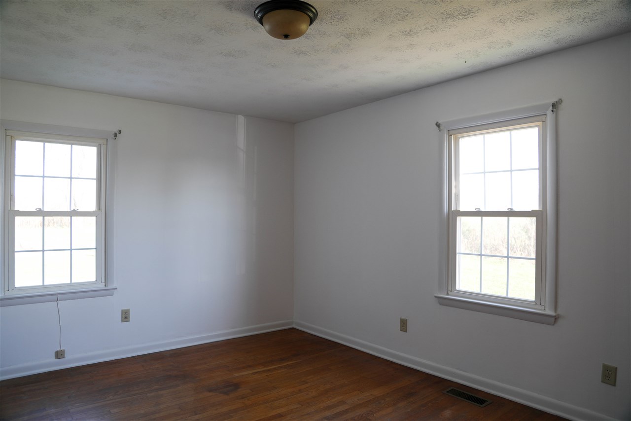 5163 East Timber Ridge Road Mount Crawford, VA 22841 - Photo 35 of 48 an empty room with wooden floor and windows