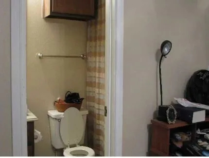 a bathroom with a toilet and a sink