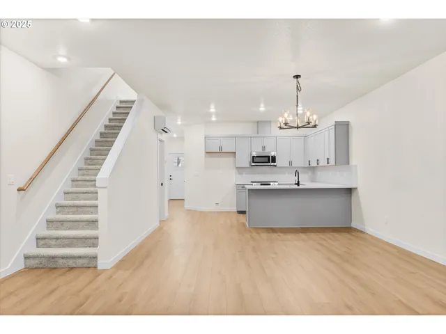 a view of hallway with wooden floor