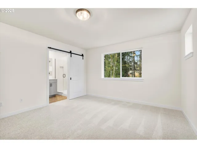 a bathroom with a double vanity sink mirror and shower