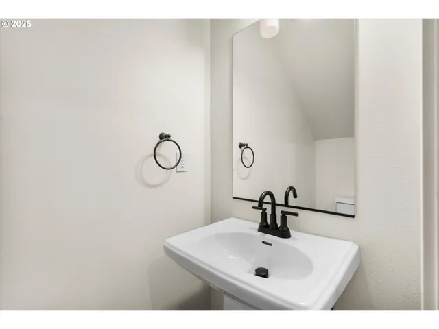 a bathroom with a sink and mirror