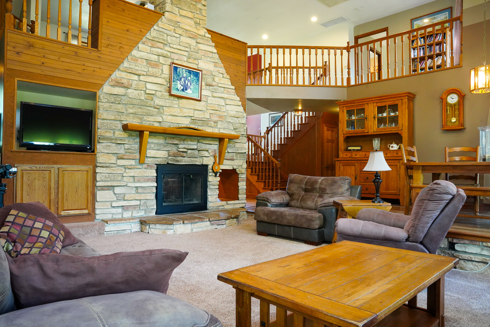 10175 Brown Road Morris, IL 60450 - Photo 11 of 31 a living room with furniture a flat screen tv and a fireplace