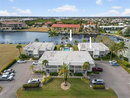 an aerial view of a house with yard swimming pool and outdoor seating