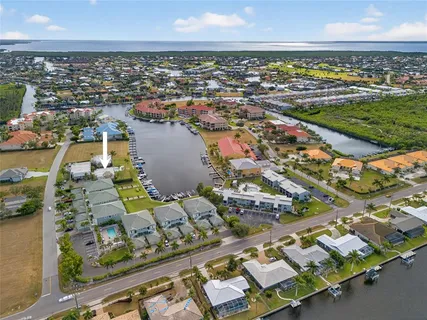 an aerial view of a house with a ocean view