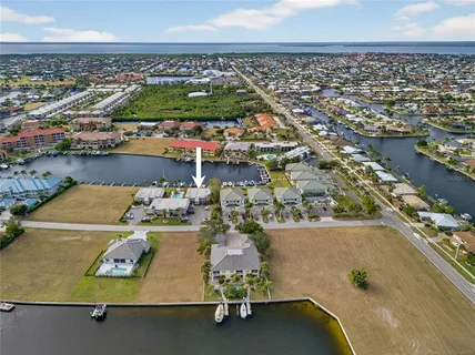 an aerial view of a house with a ocean view