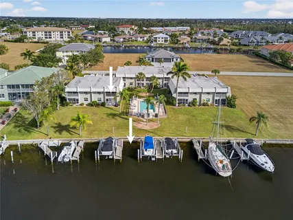 an aerial view of a house with a ocean view
