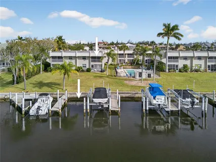 a view of an swimming pool and outdoor seating