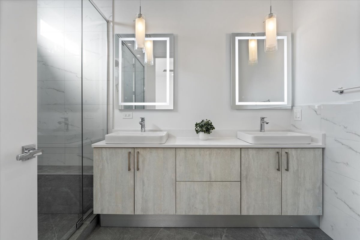 938 North California Avenue, Unit 2 Chicago, IL 60622 - Photo 11 of 20 a bathroom with a sink and a mirror