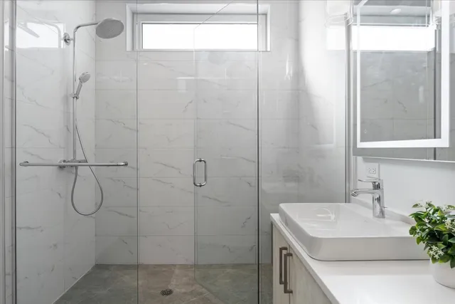 a bathroom with a sink and a shower