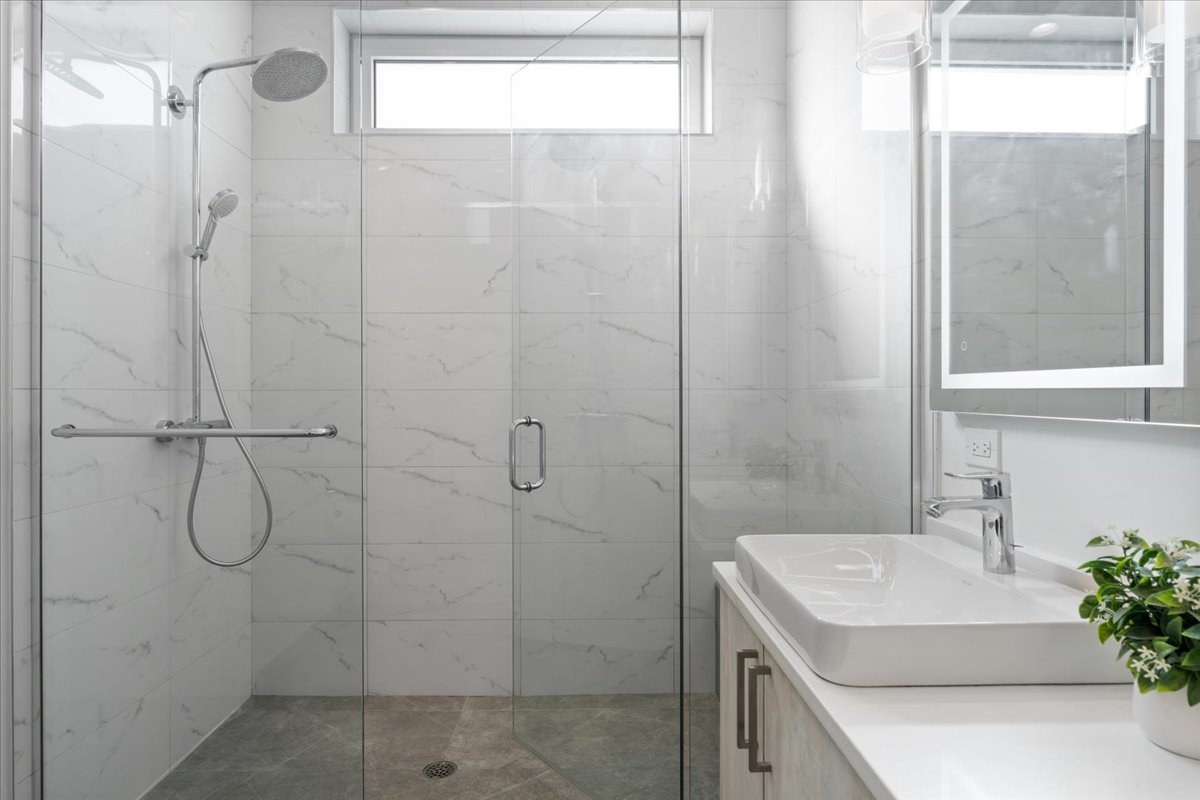 938 North California Avenue, Unit 2 Chicago, IL 60622 - Photo 12 of 20 a bathroom with a sink and a shower