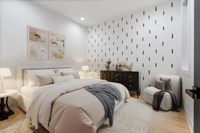 a bedroom with a bed and lamp