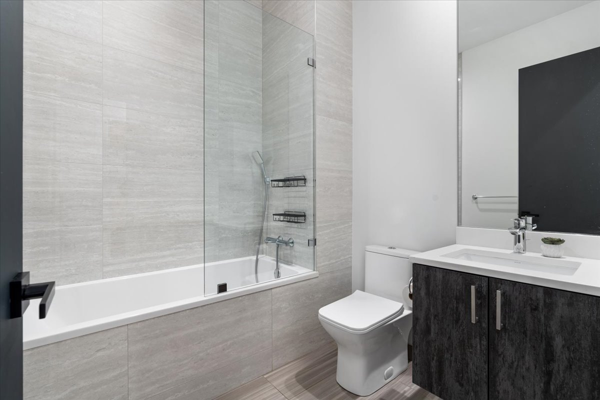 938 North California Avenue, Unit 2 Chicago, IL 60622 - Photo 16 of 20 a bathroom with a sink a toilet and shower