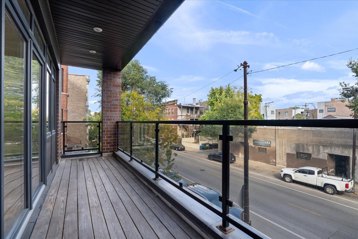 938 North California Avenue, Unit 2 Chicago, IL 60622 - Photo 17 of 20 a view of a balcony with wooden floor