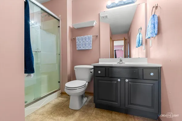 a bathroom with a sink toilet and mirror