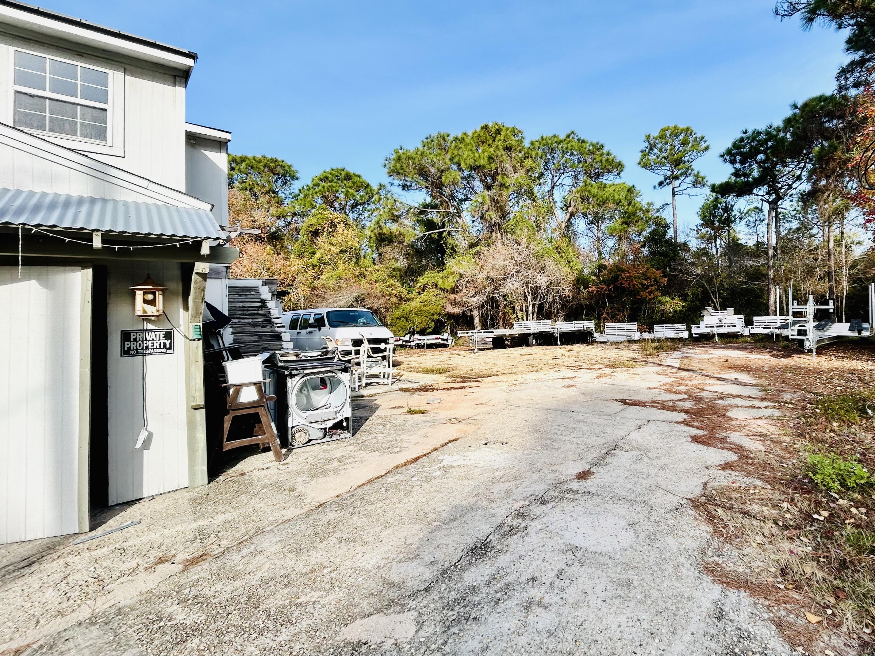 139 North Holiday Road Miramar Beach, FL 32550 - Photo 5 of 5 a view of a backyard of a house
