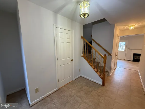 wooden floor with windows and stairs