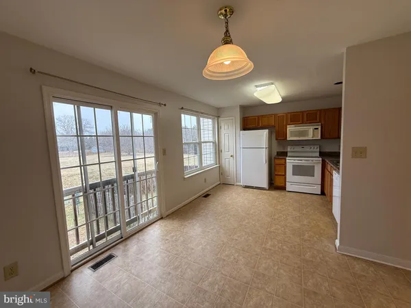 a view of a kitchen with a sink and dishwasher cabinets