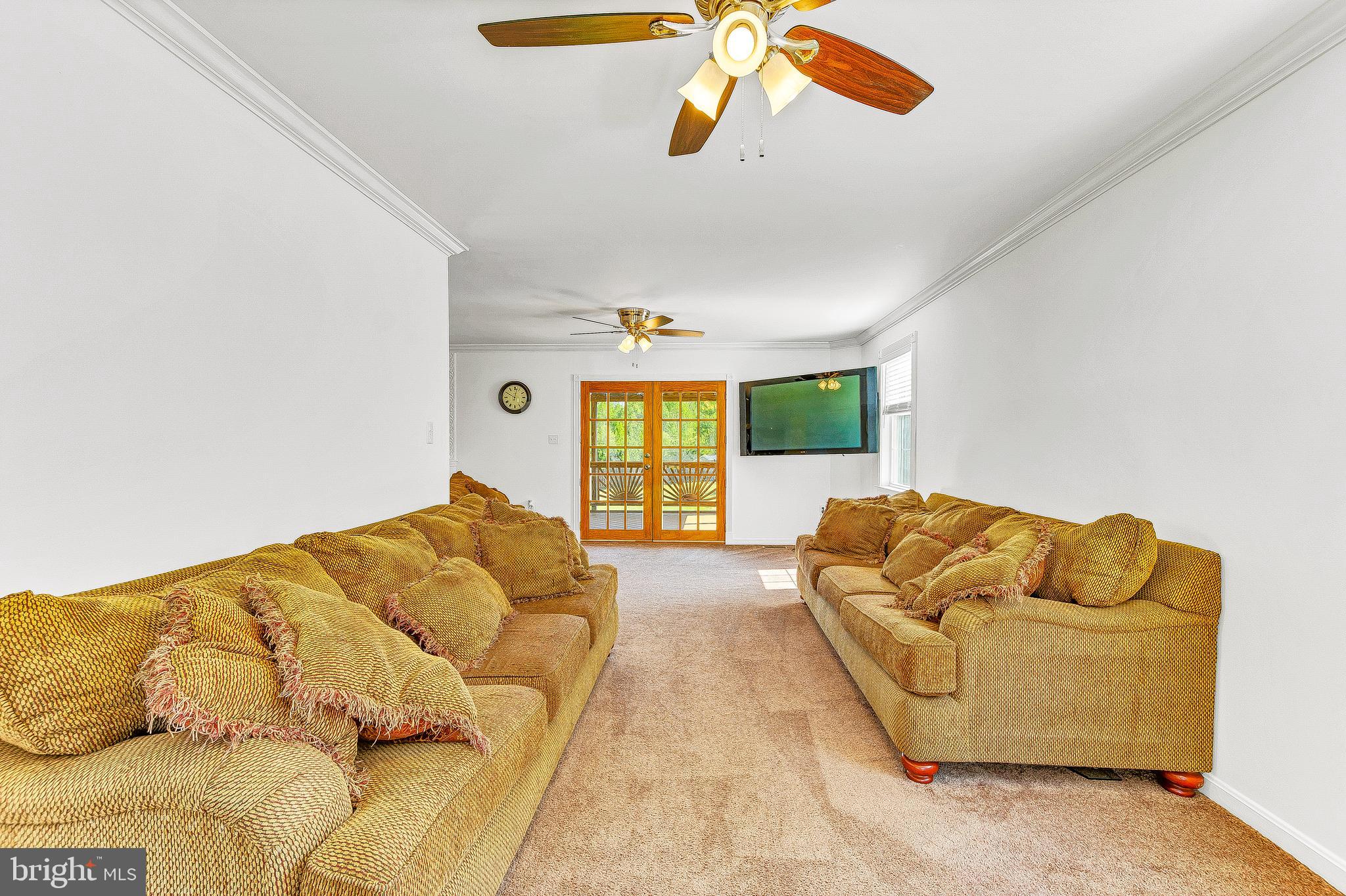 55 Walnut Creek Road Huntingtown, MD 20639 - Photo 21 of 52 Living Room Leads to Screened-In Deck...