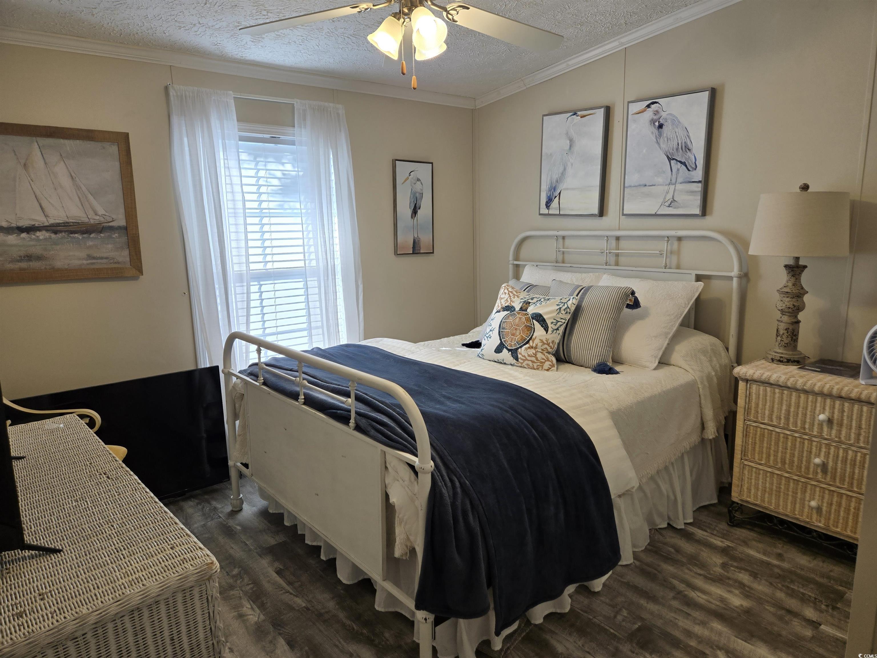 310 Clam Shell Circle Murrells Inlet, SC 29576 - Photo 16 of 32 Bedroom featuring wood finished floors, a textured ceiling, ornamental molding, and ceiling fan