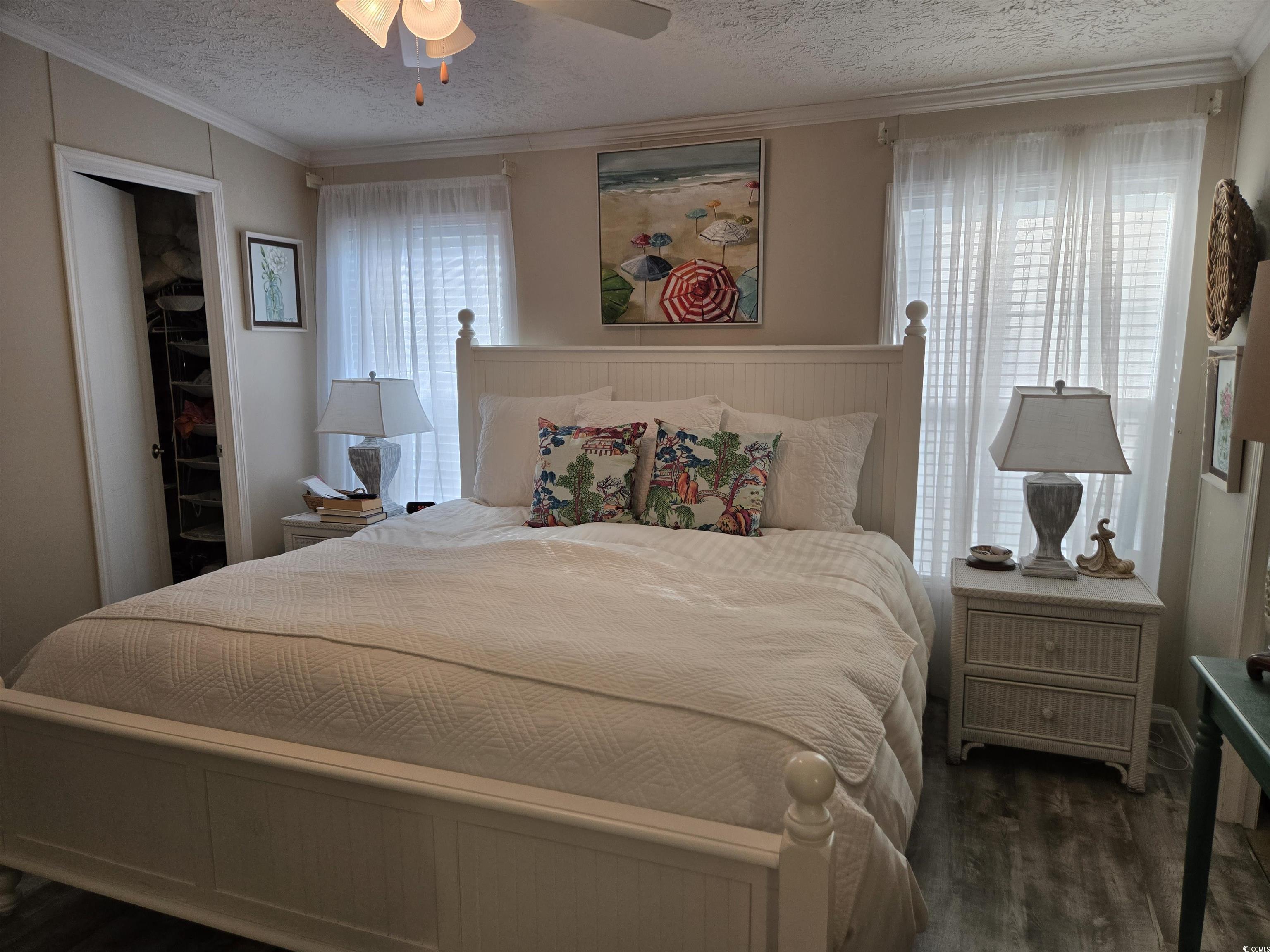 310 Clam Shell Circle Murrells Inlet, SC 29576 - Photo 17 of 32 Bedroom featuring wood finished floors, a textured ceiling, ornamental molding, and ceiling fan