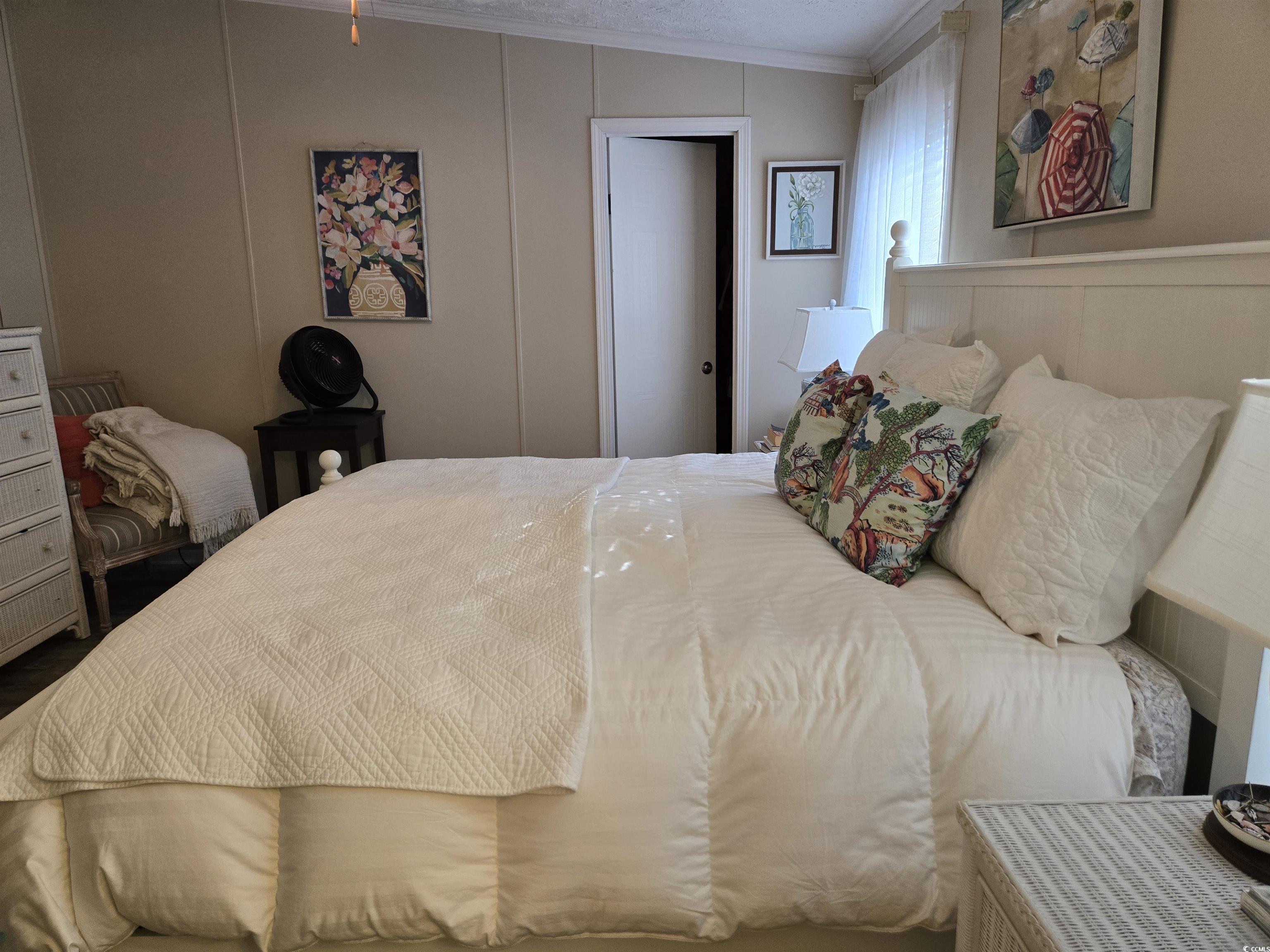 310 Clam Shell Circle Murrells Inlet, SC 29576 - Photo 18 of 32 Bedroom with a decorative wall and crown molding