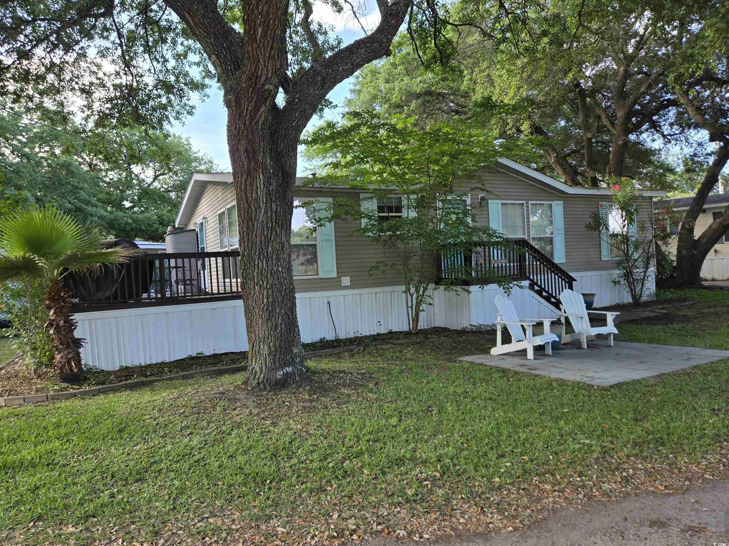 310 Clam Shell Circle Murrells Inlet, SC 29576 - Photo 2 of 32 View of front facade with a front lawn, a patio, and a deck