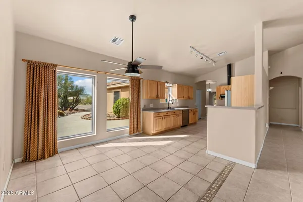 a view of a kitchen with furniture and a window