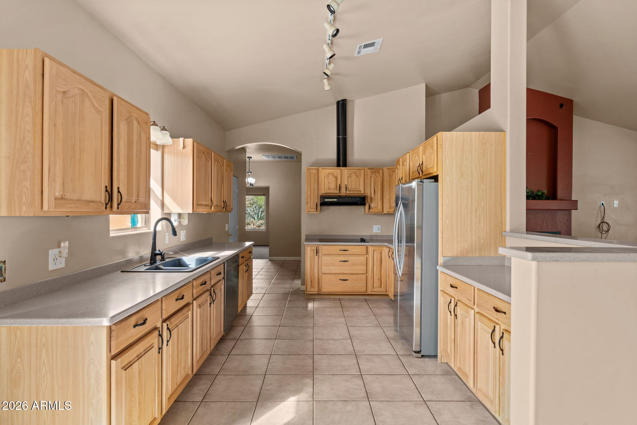 21340 Date Creek Road Wickenburg, AZ 85390 - Photo 14 of 35 a kitchen with a sink a stove and refrigerator