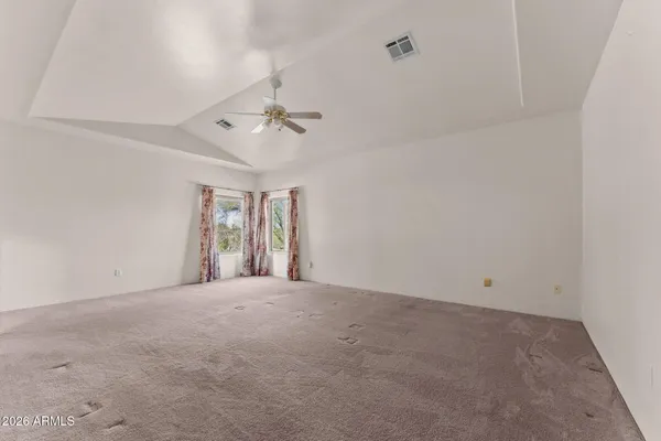 a view of an empty room with a window