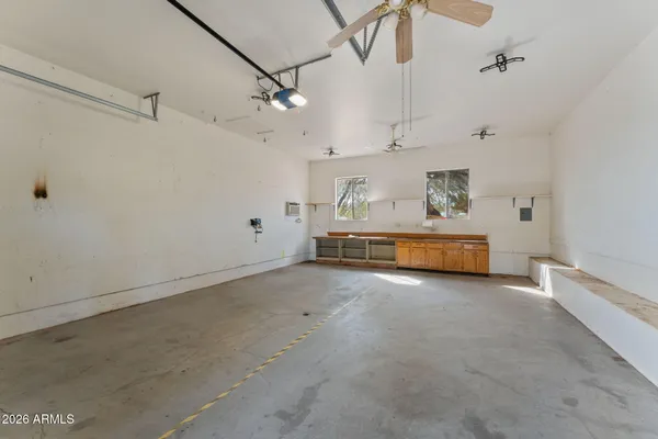 a view of a room with natural light and hardwood floor