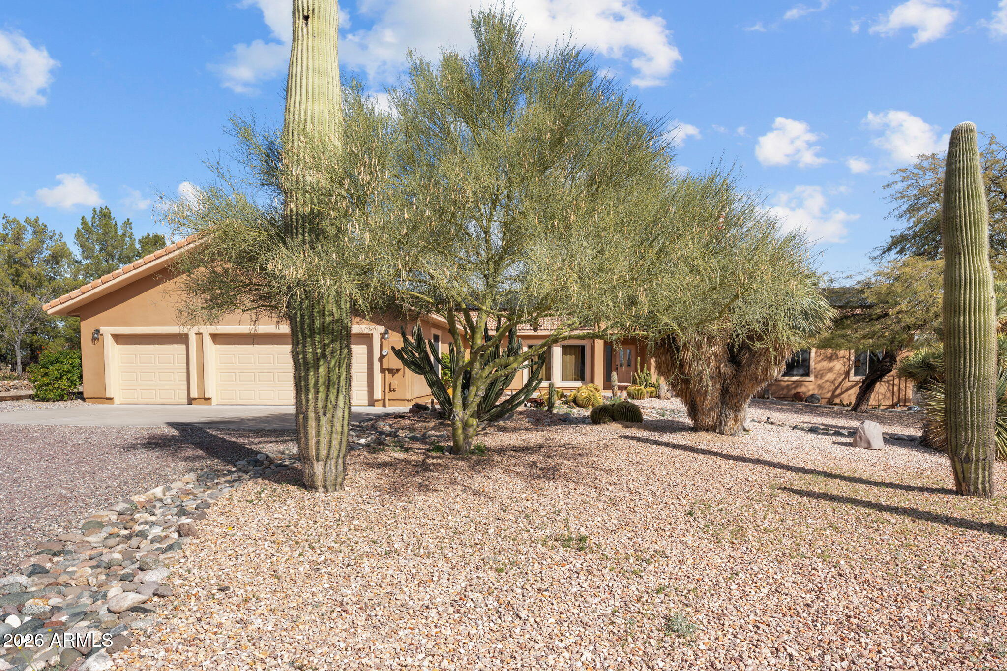21340 Date Creek Road Wickenburg, AZ 85390 - Photo 35 of 35 a view of a house with a snow on the road and trees