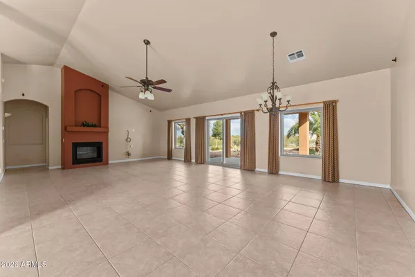 a view of a kitchen with a sink and a chandelier