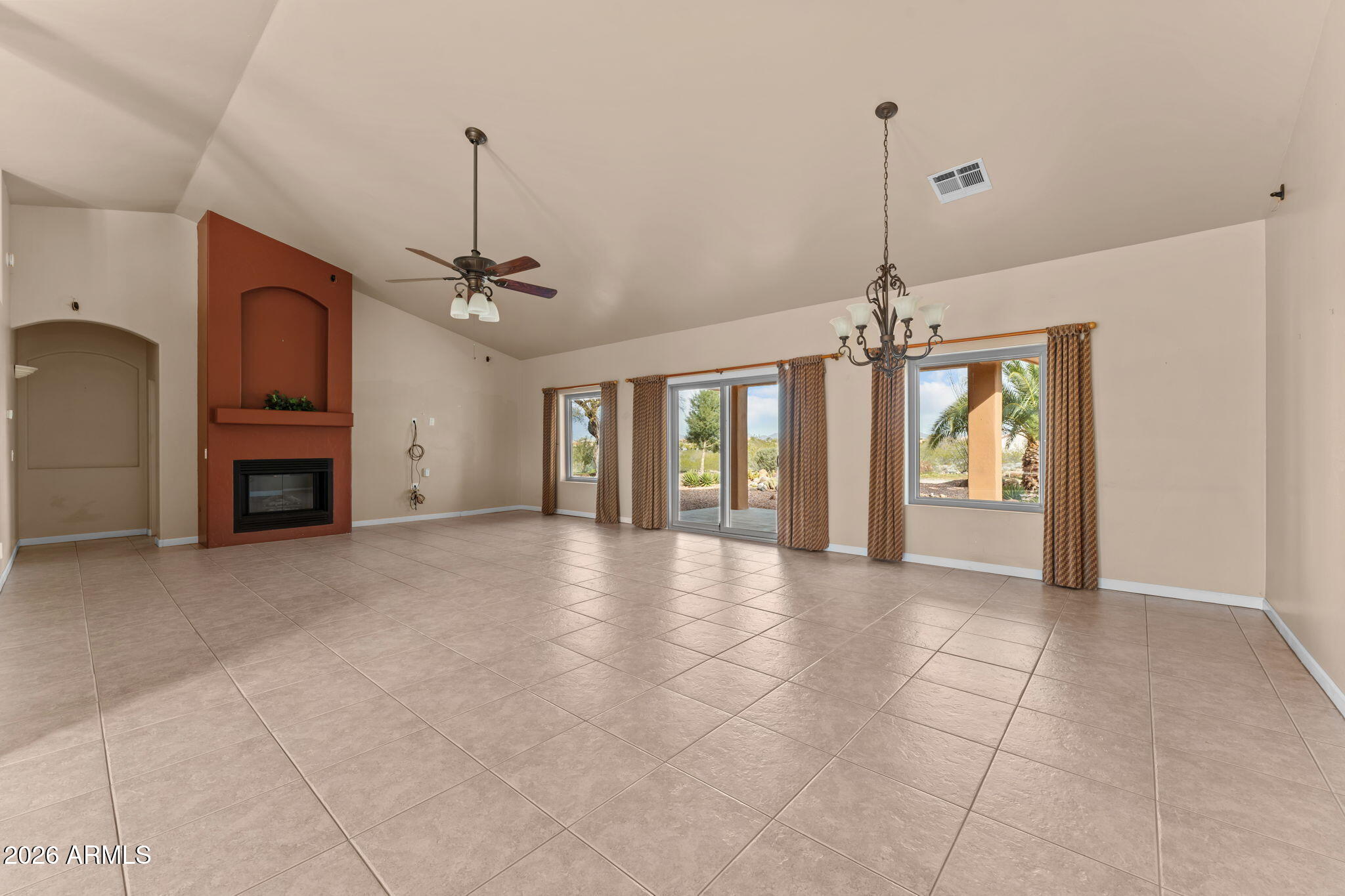 21340 Date Creek Road Wickenburg, AZ 85390 - Photo 4 of 35 a view of a kitchen with a sink and a chandelier