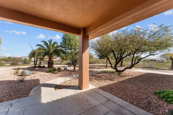 a view of a backyard and trees