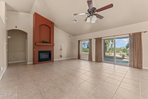 a view of an empty room with a fireplace