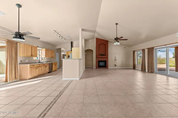a view of a kitchen with a sink and a window