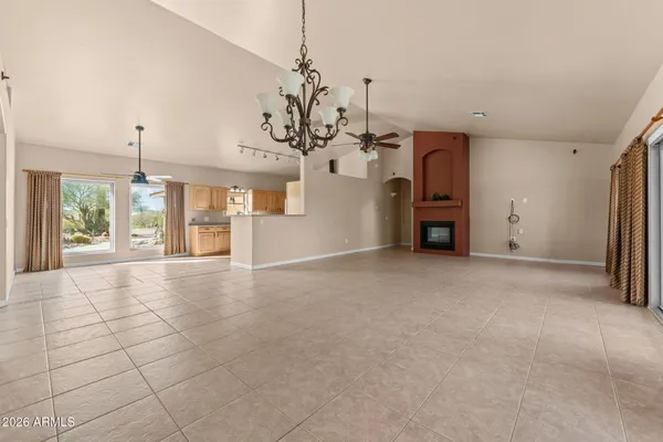 a view of a kitchen with a sink and a chandelier