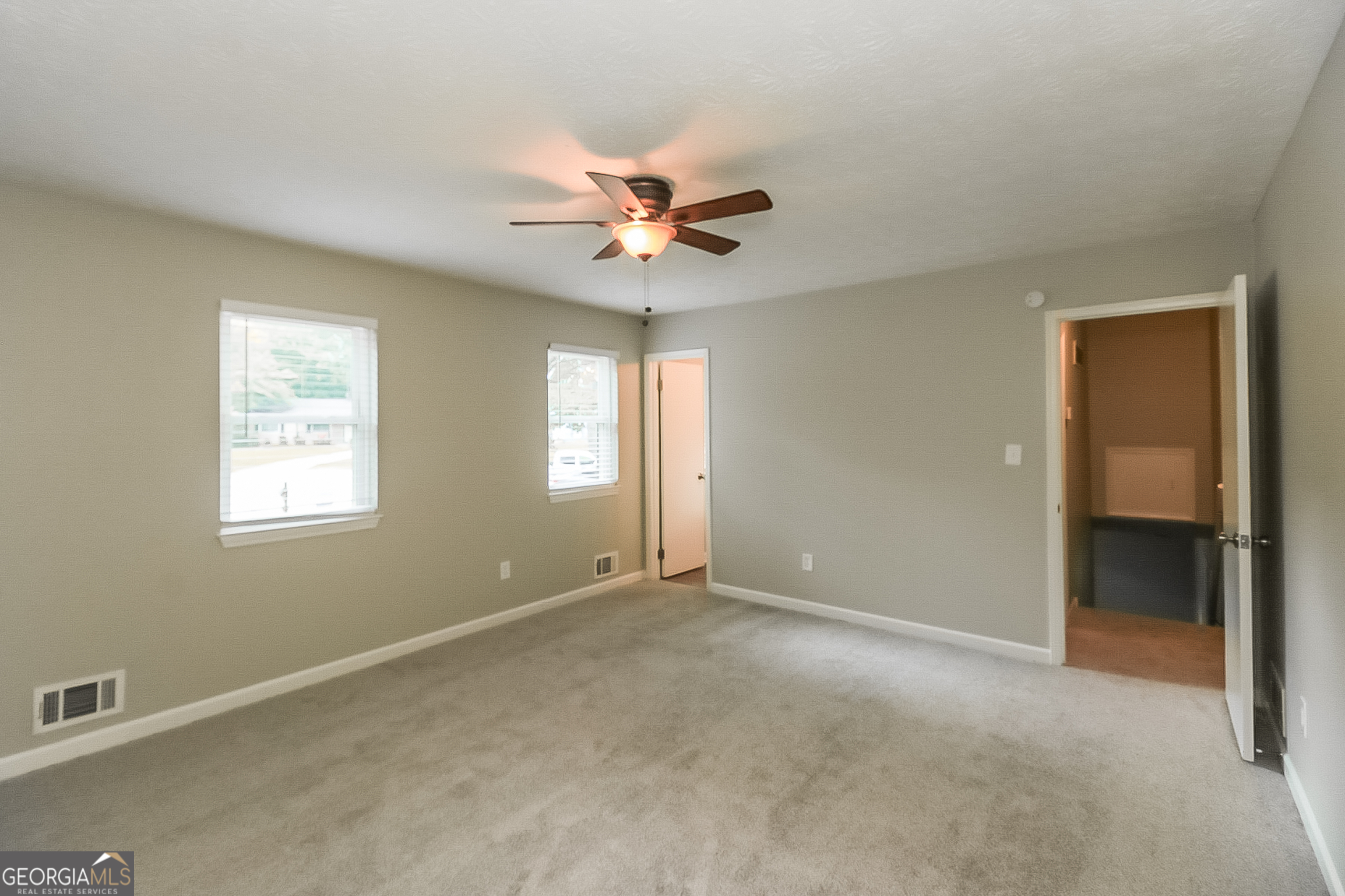 7548 Colonial Court Jonesboro, GA 30236 - Photo 9 of 17 a view of an empty room with a window