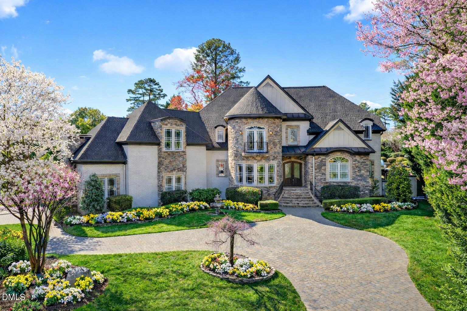 6701 Foxfire Place Raleigh, NC 27615 - Photo 1 of 67 a front view of a house with a garden
