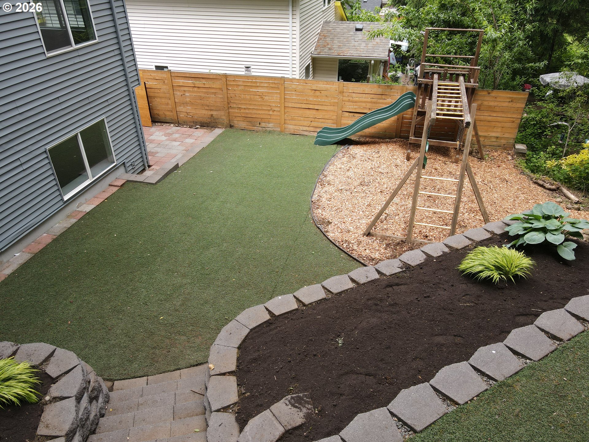 4024 Southeast 154th Place Portland, OR 97236 - Photo 31 of 43 a view of a backyard with sitting area