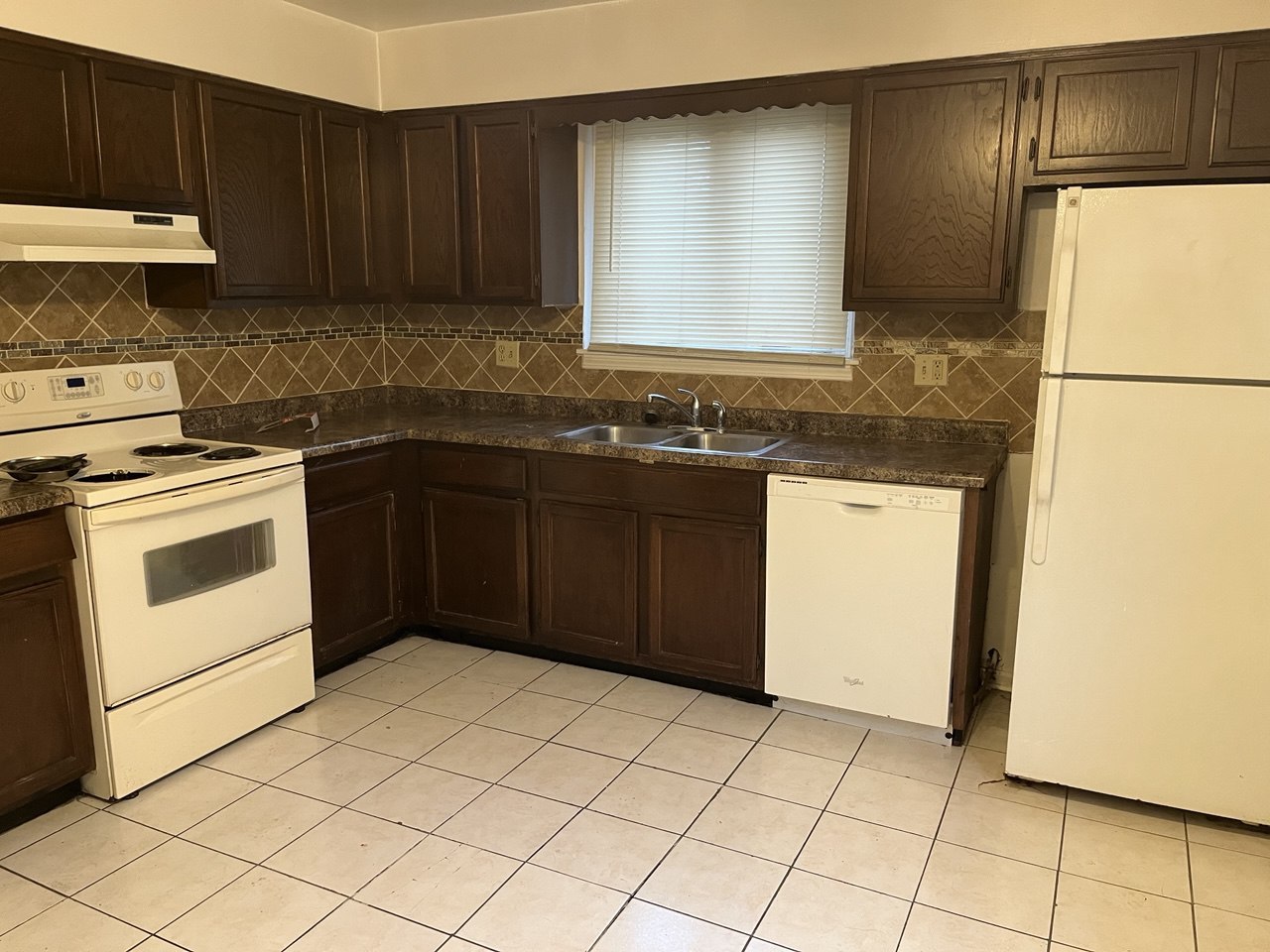 4062 Charleston Road, Unit 1W Matteson, IL 60443 - Photo 2 of 2 a kitchen with a cabinets sink and white appliances