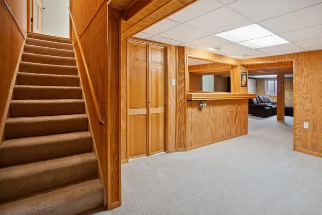 a view of entryway with wooden floor and windows