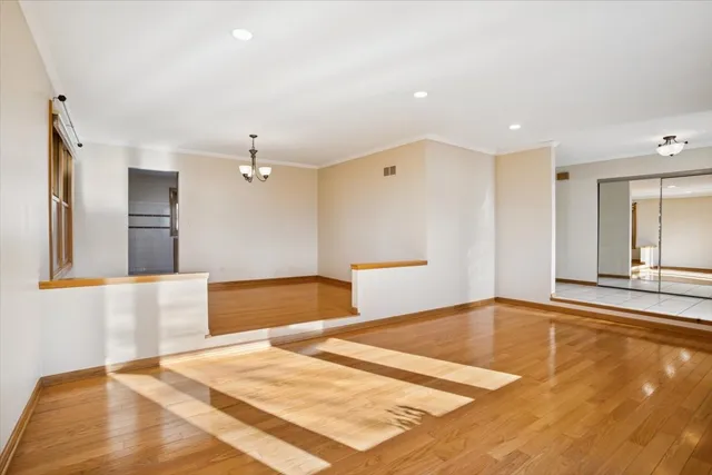 a bedroom with a bed and a large mirror