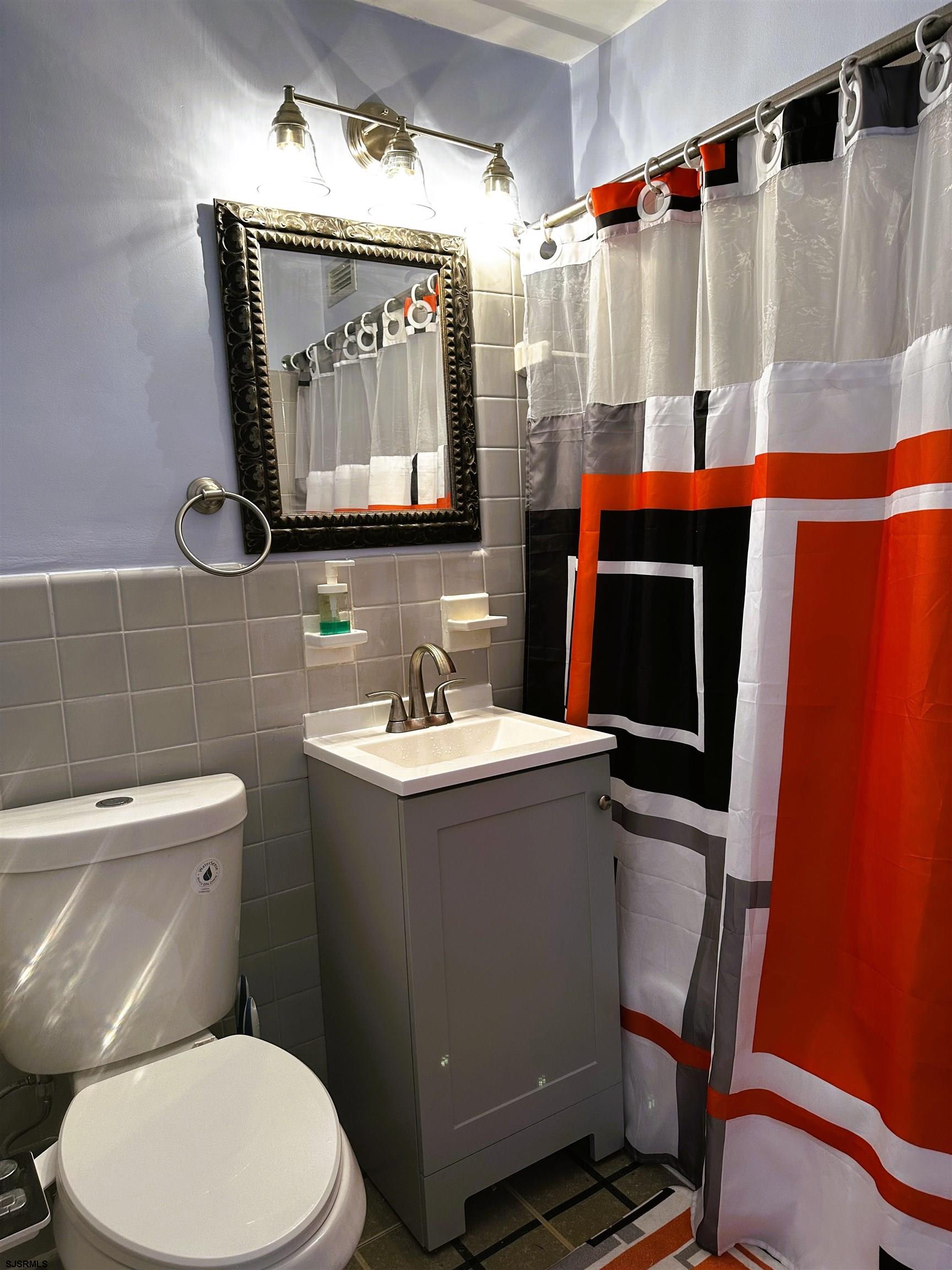 101 South Raleigh Avenue, Unit 232 Atlantic City, NJ 08401 - Photo 11 of 18 a bathroom with a sink a toilet and shower