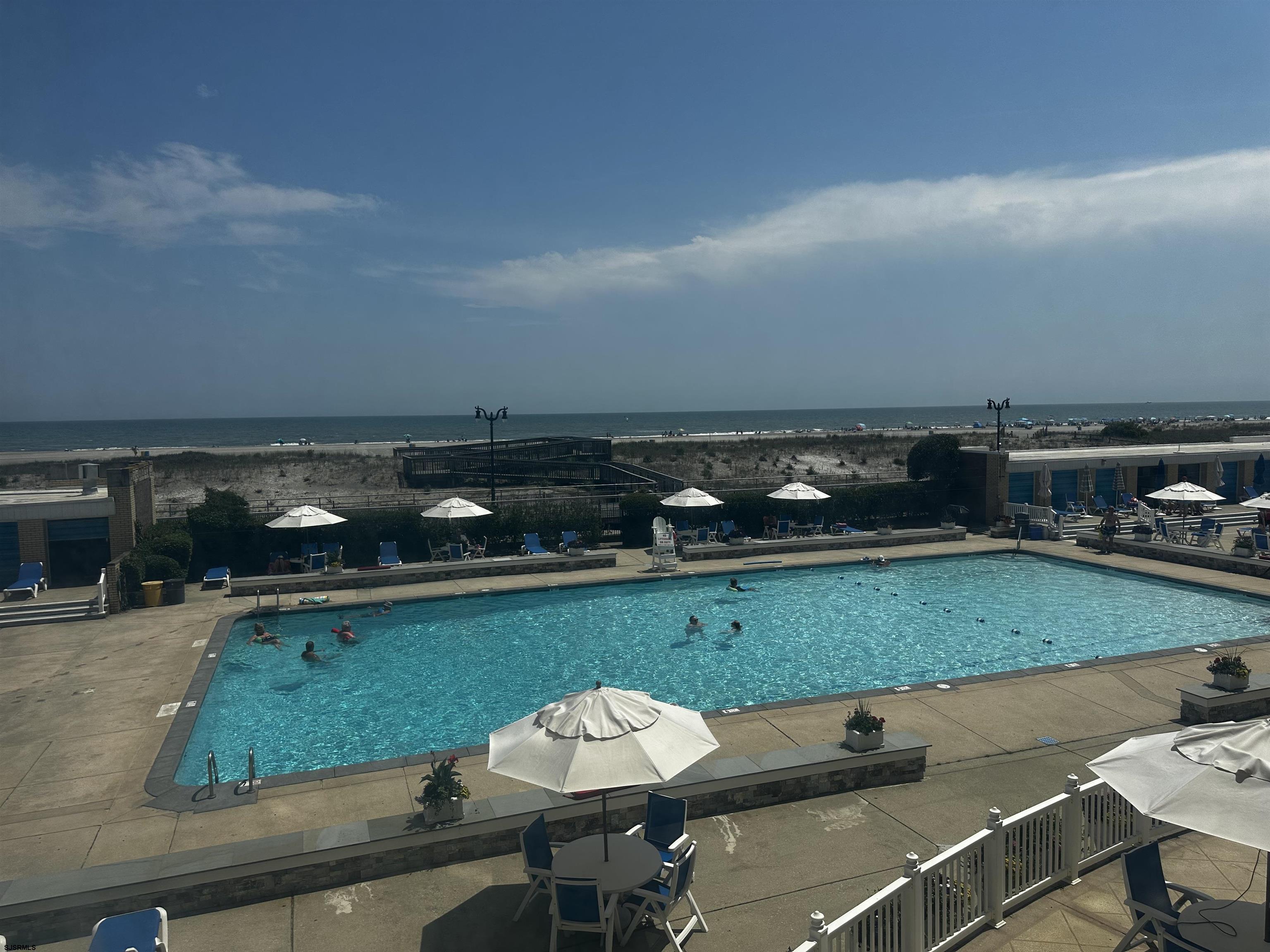 101 South Raleigh Avenue, Unit 232 Atlantic City, NJ 08401 - Photo 17 of 18 a view of a swimming pool and lounge chairs
